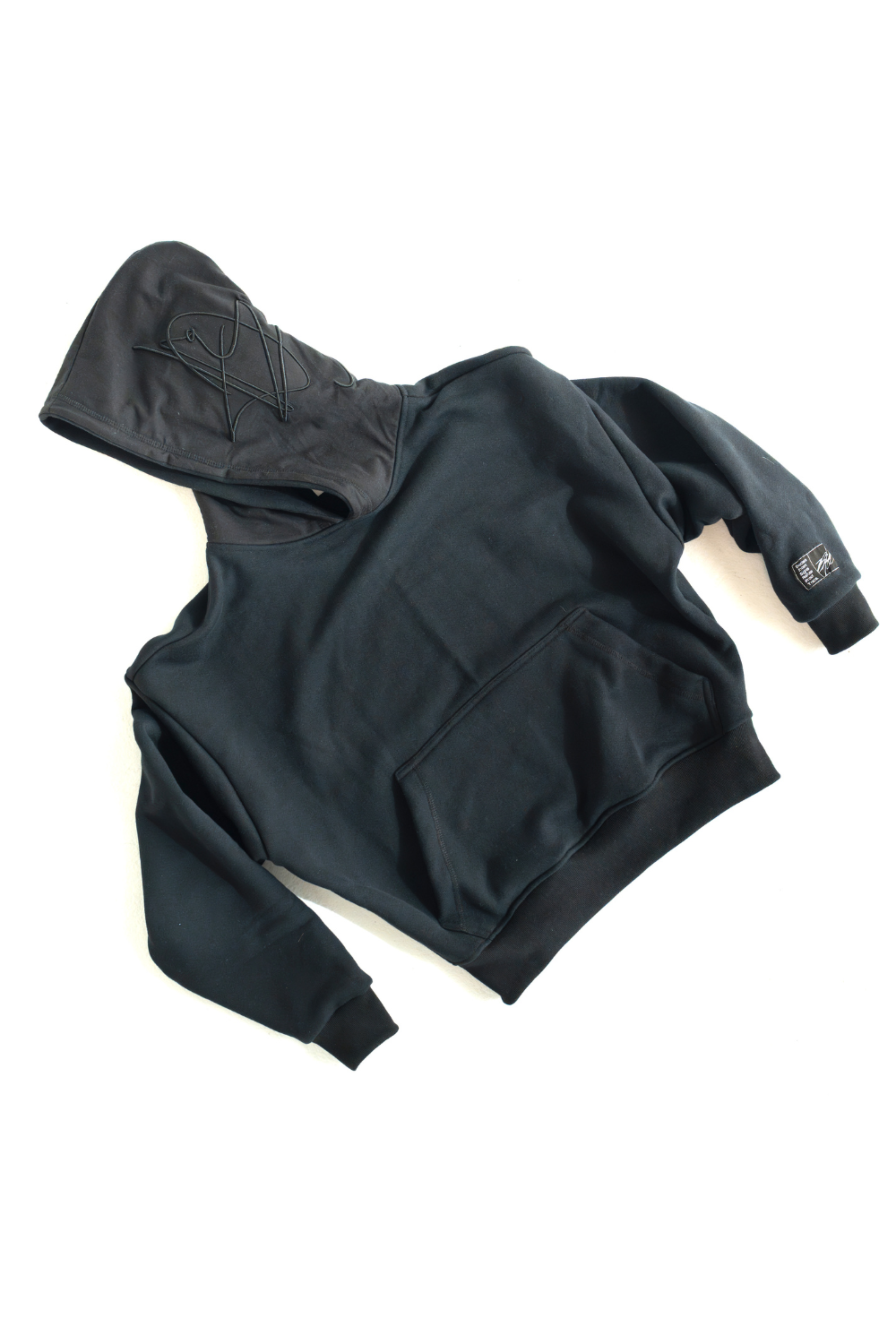 Black DISRPT signature heavyweight hoodie front view on white background with minimalist design and relaxed fit