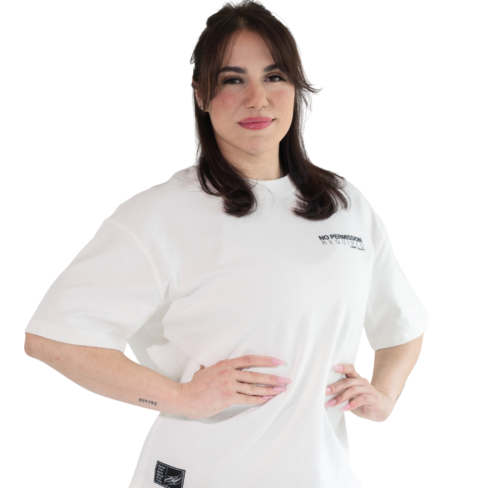 Woman wearing white DISRPT No Permission Required box tee in front view on white background with minimalist design and boxy fit