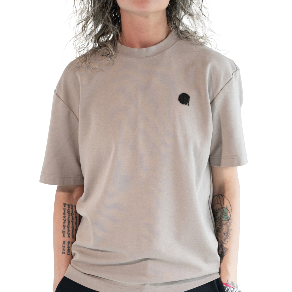 DISRPT stone emblem t-shirt with minimal chest logo worn on model front view