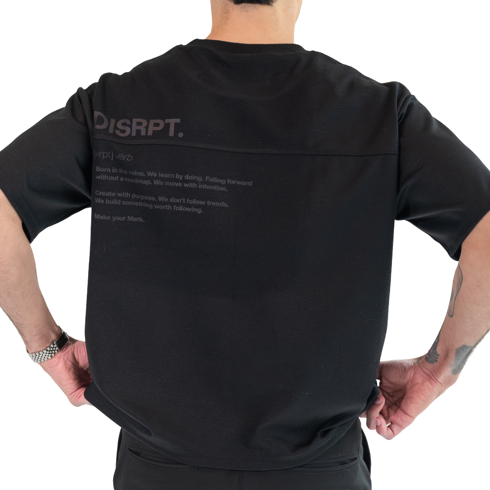 DISRPT black boxy t-shirt back view showcasing tonal DISRPT logo and manifesto graphic design