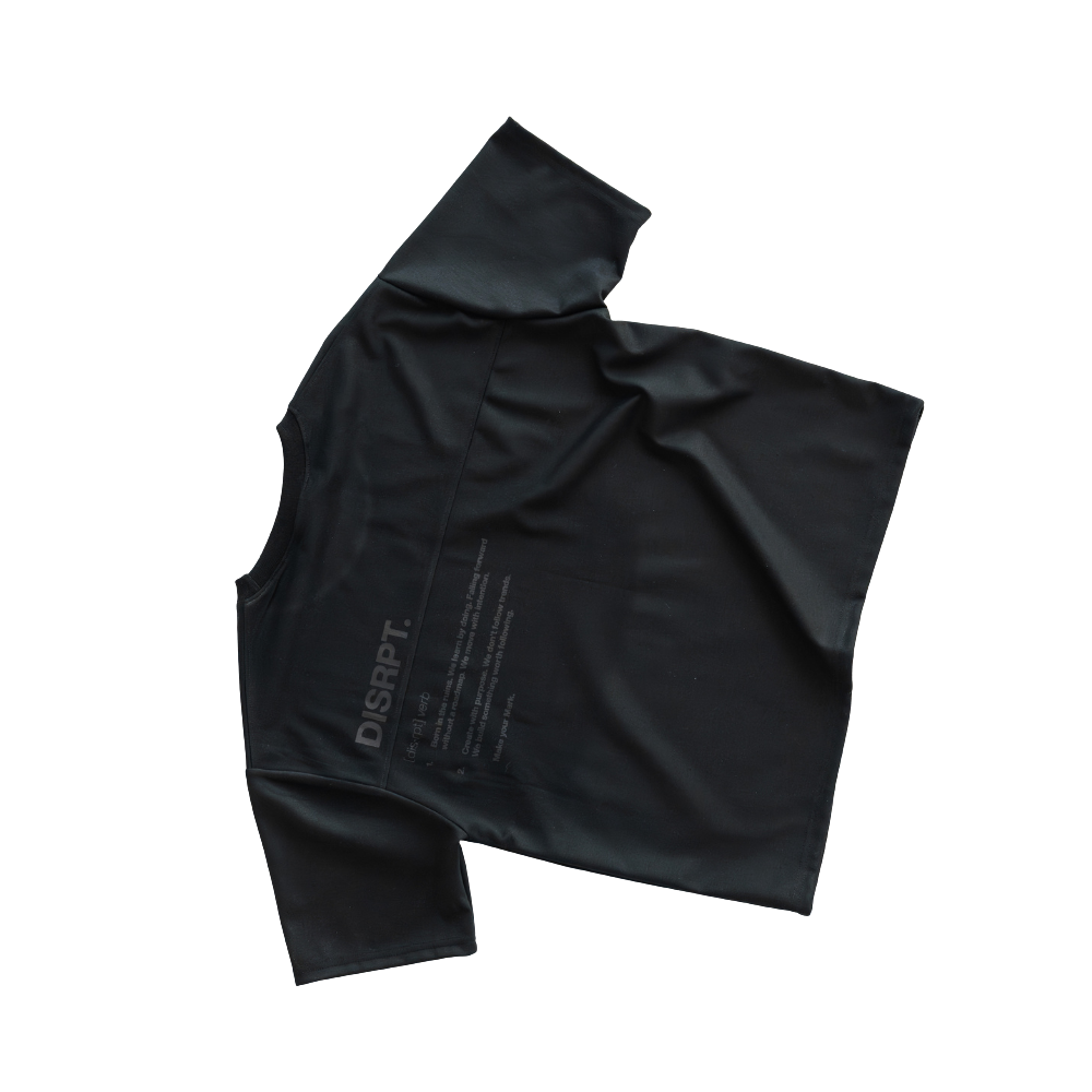 Black DISRPT boxy t-shirt flatlay showcasing premium fabric texture and structured fit