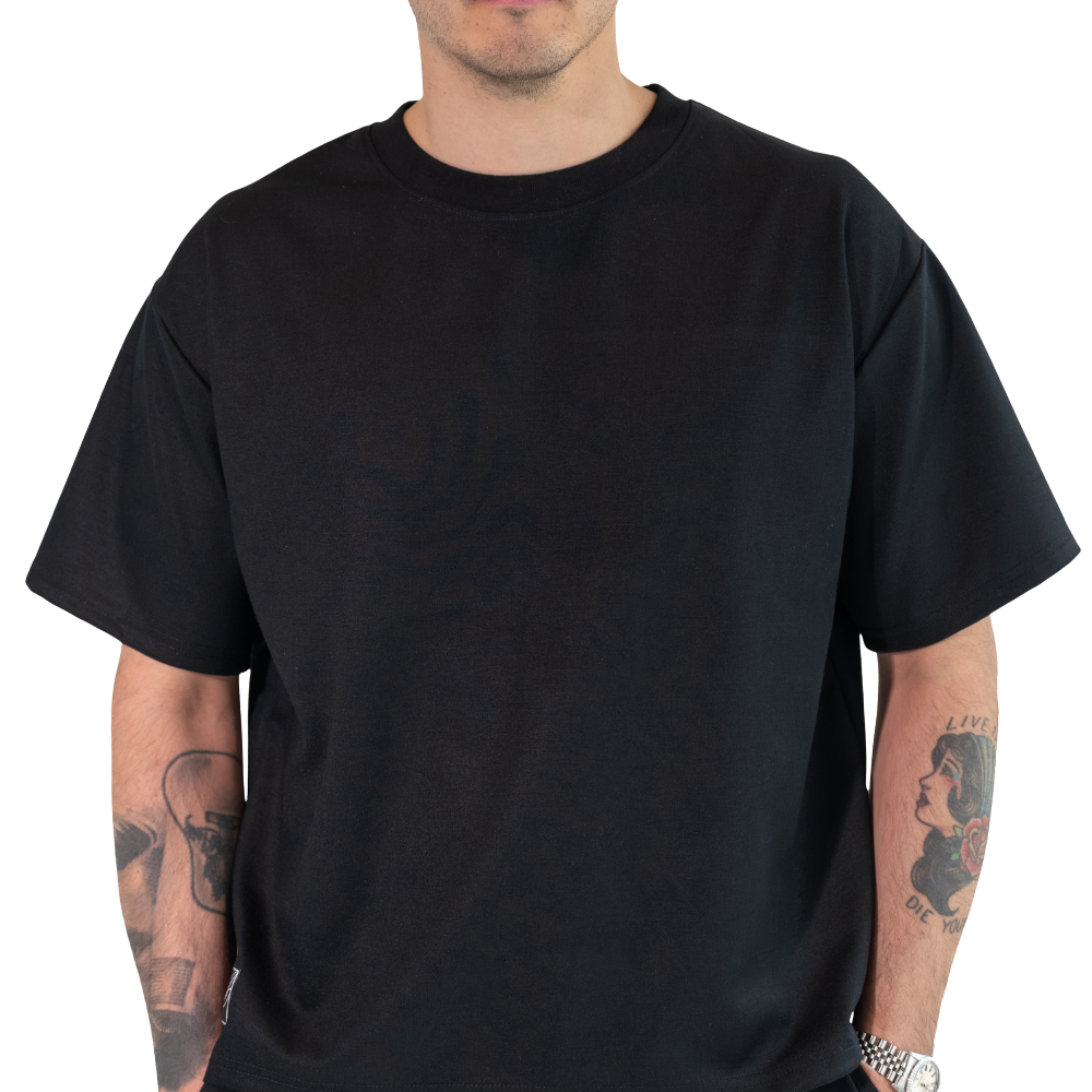 DISRPT black boxy t-shirt front view highlighting oversized fit, structure, and premium fabric weight